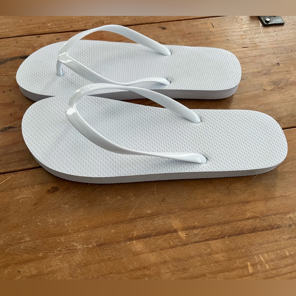 White Womens Flip Flops Size 7/8. Never worn